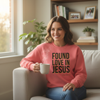 Person wearing coral Found Love in Jesus sweatshirt