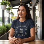 Person wearing navy Let Love Lead tee