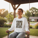 Person wearing white Found Love in Jesus sweatshirt